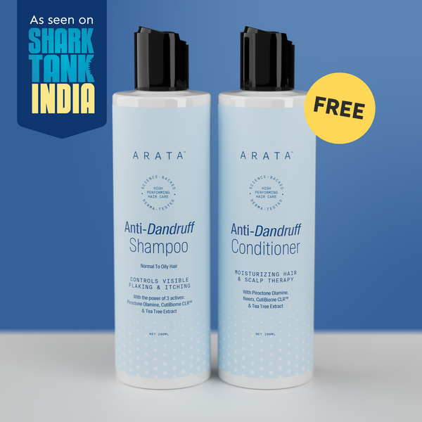 Two bottles of Arata Anti-Dandruff Shampoo and Conditioner on a blue background with 'Shark Tank India' branding.