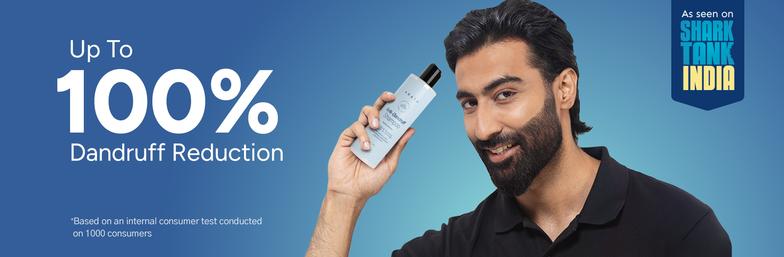 Man holding a bottle with dandruff reduction product on a blue background, featuring Shark Tank India logo.